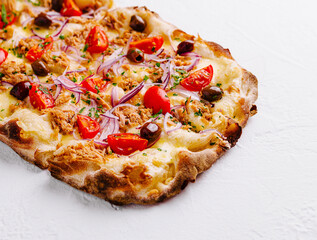 Gourmet tuna and tomato pizza on white background