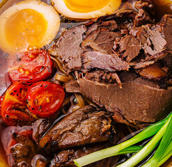 Savory beef ramen bowl with egg and vegetables