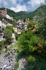 View of small village under the hills on Lombardy Alps