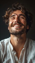 Fototapeta premium portrait of a joyful young man with curly hair and mustache