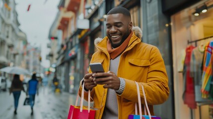 A cheerful man wearing a yellow jacket is shopping in the city, happily using his smartphone and carrying bags. The urban scene reflects modern consumerism and technology in everyday city life