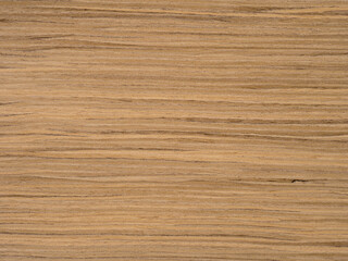 Warm ochre hues and earthen tones dance across the smooth surface of this elegant oak veneer