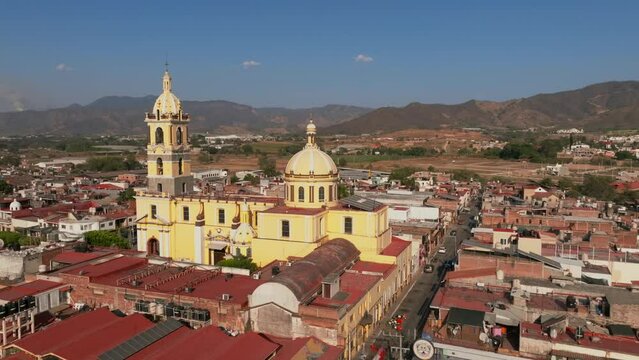 The Santuario Diosesano De La Virgen Del Sagrario church in Tamazula de Gordiano, aerial dolly in and right to left orbit