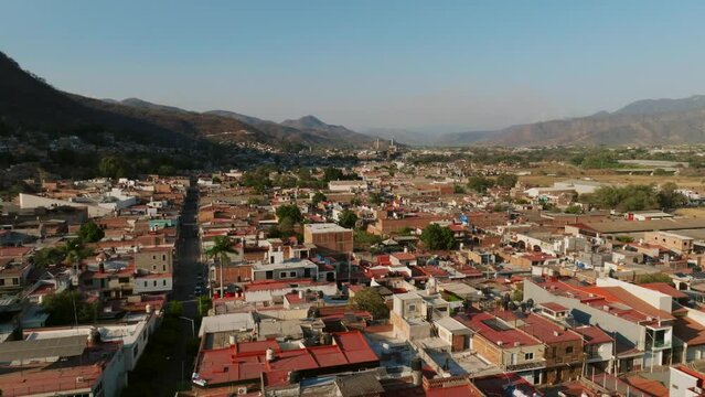 Aerial flight over a residential area in Tamazula de Gordiano, Mexico, during daytime