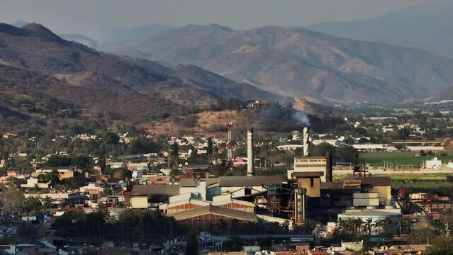 Aerial perspective looking at the sugar cane factory in Tamazula de Gordiano, dolly out