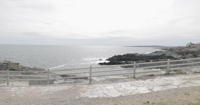 Beautiful coastal waters and rocky shores of the Atlantic Ocean in a public park in Portand Maine.