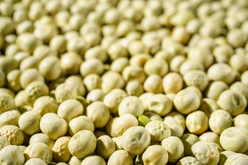Background of a green peas grains close up. Food pattern.