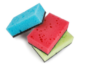 Several colored dishwashing sponges isolated on a white background.
