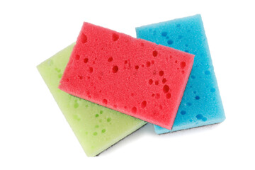 Several colored dishwashing sponges isolated on a white background.