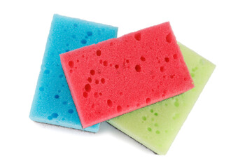 Several colored dishwashing sponges isolated on a white background.