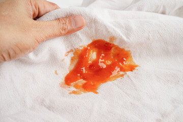 Dirty tomato sauce stain or ketchup on cloth to wash with washing powder, cleaning housework...