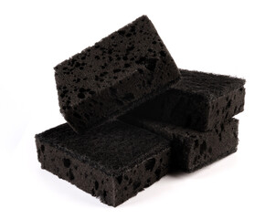 Sponge for washing dishes . Completely black household sponge.