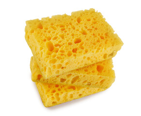 A stack of yellow dishwashing sponges isolated on a white background.