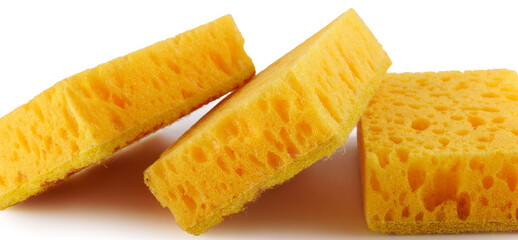 Several yellow sponges for washing dishes isolated on a white background. Household cleaning sponge.
