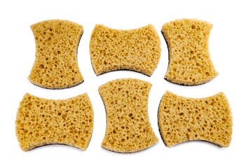 Beautifully arranged curly sponges for washing dishes isolated on a white background. Household cleaning sponge.