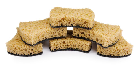 Beautifully arranged curly sponges for washing dishes isolated on a white background. Household cleaning sponge.