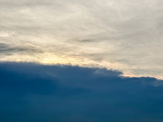 Beautiful dark sky at sunset with cumulus clouds after rain