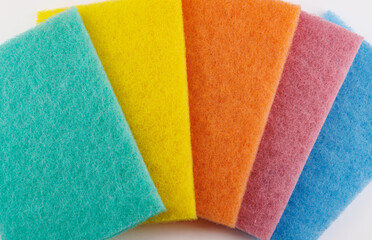 Multi-colored cleaning sponge. Background made from multi-colored cleaning cloth.