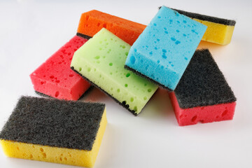 A multi-colored cleaning sponge scattered across the surface. Multi-colored household sponge.