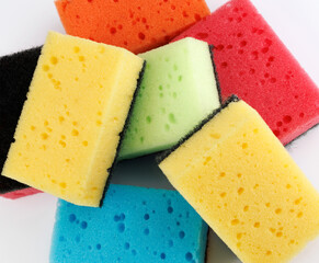 A multi-colored cleaning sponge scattered across the surface. Multi-colored household sponge.