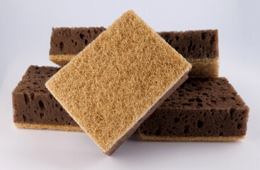 Several sponges for washing dishes. Brown household sponge.