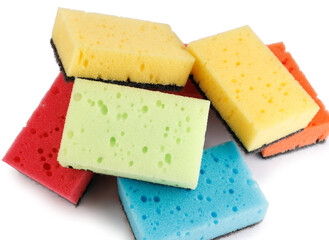A multi-colored cleaning sponge scattered across the surface. Multi-colored household sponge.