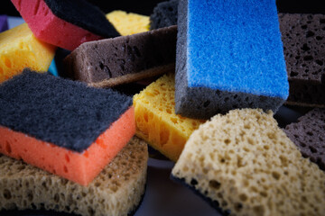 Background of mixed colorful sponges. Household cleaning sponge.