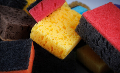 Background of mixed colorful sponges. Household cleaning sponge.