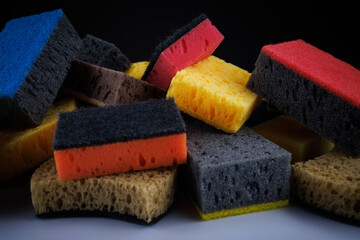 Background of mixed colorful sponges. Household cleaning sponge.