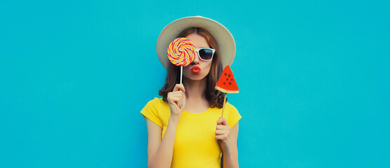 Summer portrait of stylish young woman with juicy lollipop or ice cream shaped slice of watermelon