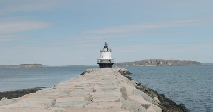 Spring point ledge light house at the end of a rock pier on the Atlantic Ocean.
