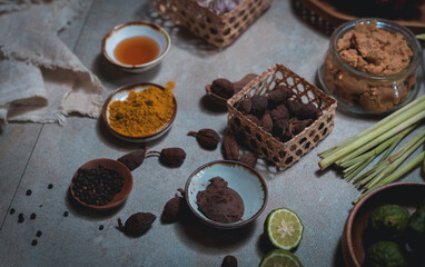 Many ingredients, including ginger, shallots, chilli, lime, scallions, pepper and others, are prepared to be cooked to make Thai food.