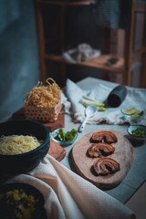 Khao Soi, a local dish of northern Thailand, is filled with various spices including lime, shallots, and chili.