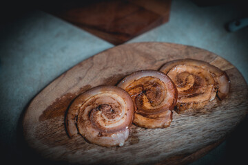 Men tie ropes and cut pork to make Japanese-style pork slices.