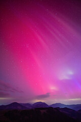 Massive solar storm with pink aurora borealis over central europe. Northern light event on May 10,...