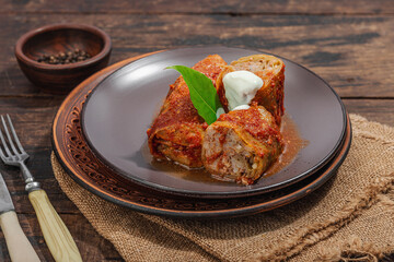 Cabbage rolls stuffed with rice and meat stewed in tomato sauce. Traditional dish, ready-to-eat food