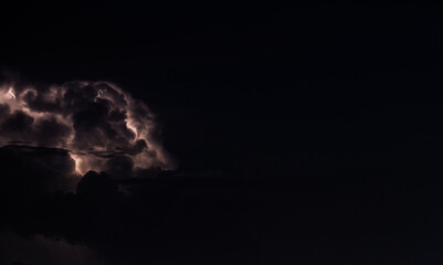 Photography of lightning in the dark night sky.