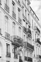 Paris, France. Gorgeous Apartments Building in Haussmann Architecture Style. Monochrome Paris Cityscape. 