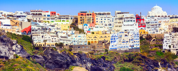 Obraz premium Fira or Thira, Santorini, Greece panoramic banner with white and blue colorful houses on high volcanic rocks