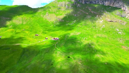 View from above, stunning aerial view of the mountain range of Seceda during a cloudy day