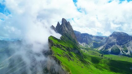 View from above, stunning aerial view of the mountain range of Seceda during a cloudy day