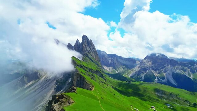 View from above, stunning aerial view of the mountain range of Seceda during a cloudy day