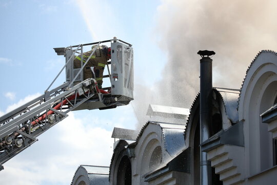 Fire in the church temple. The church cathedral is on fire. Heavy smoke in the temple area. The roof of the cathedral caught fire. Fire in the church.