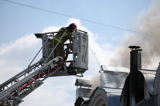 Fire in the church temple. The church cathedral is on fire. Heavy smoke in the temple area. The roof of the cathedral caught fire. Fire in the church.
