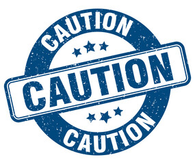 caution stamp. caution label. round grunge sign