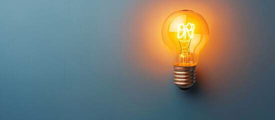 Single light bulb, still life as symbol of idea with copy space