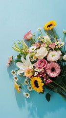 Beautiful bouquet of flowers on a blue background flat lay