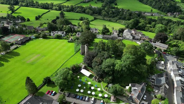 Drone footage of the ruins of Crickhowell Castle on a sunny day in Crickhowell, Wales, UK