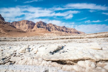 Stunning landscape of snow-covered mountains, with a patch of land in the center