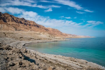 the coast line is empty, but the water is still blue: dead sea